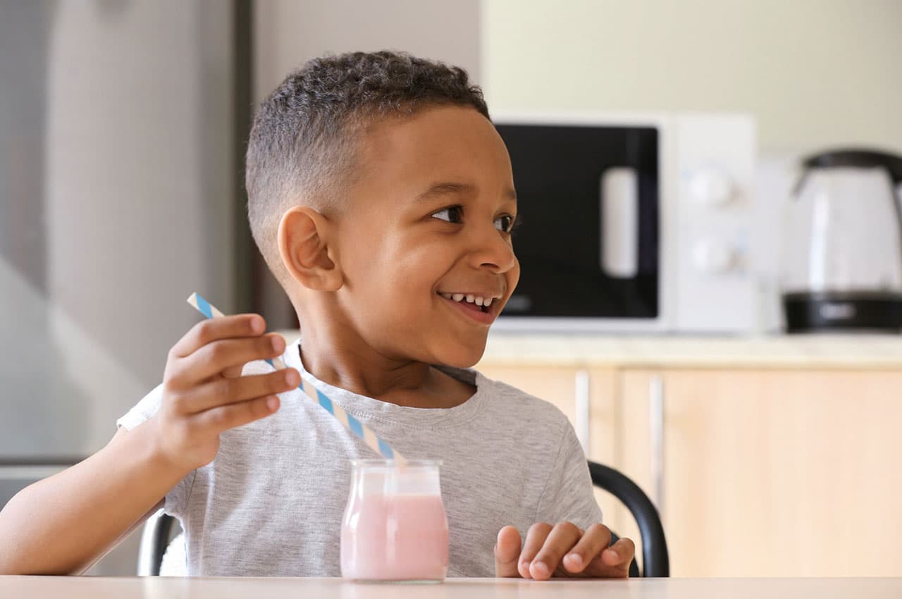 Kid enjoying a smoothie